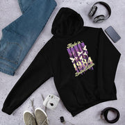Black pullover hoodie laid flat, printed with a purple and cream Made in 1984 Limited Edition birth-year design.