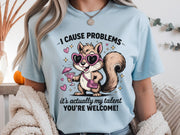 Funny squirrel graphic t-shirt with playful quote “I cause problems it’s actually my talent,” featuring cartoon squirrel with sunglasses and cocktail, worn as a casual summer outfit.