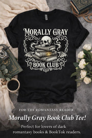 Black graphic t-shirt flat lay featuring “Morally Gray Book Club” design with a skull resting on stacked books, gothic ornamental details, and a glowing eye element, styled with books, coffee, and white roses for a dark academia aesthetic.
