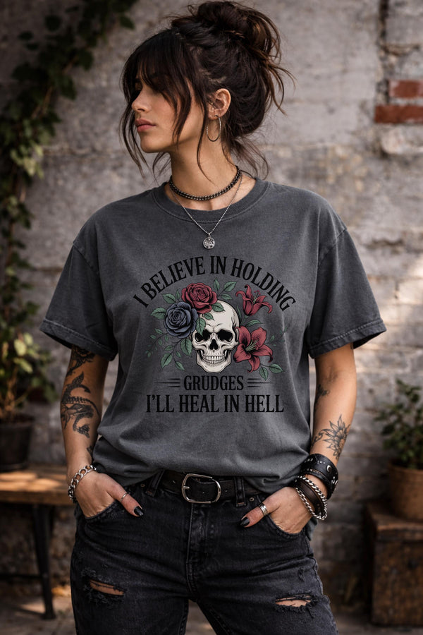 Gothic skull and roses t-shirt reading “I believe in holding grudges I’ll heal in hell”, dark aesthetic graphic tee, edgy grunge style unisex shirt