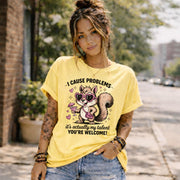 Funny squirrel graphic t-shirt with playful quote “I cause problems it’s actually my talent,” featuring cartoon squirrel with sunglasses and cocktail, worn as a casual summer outfit.