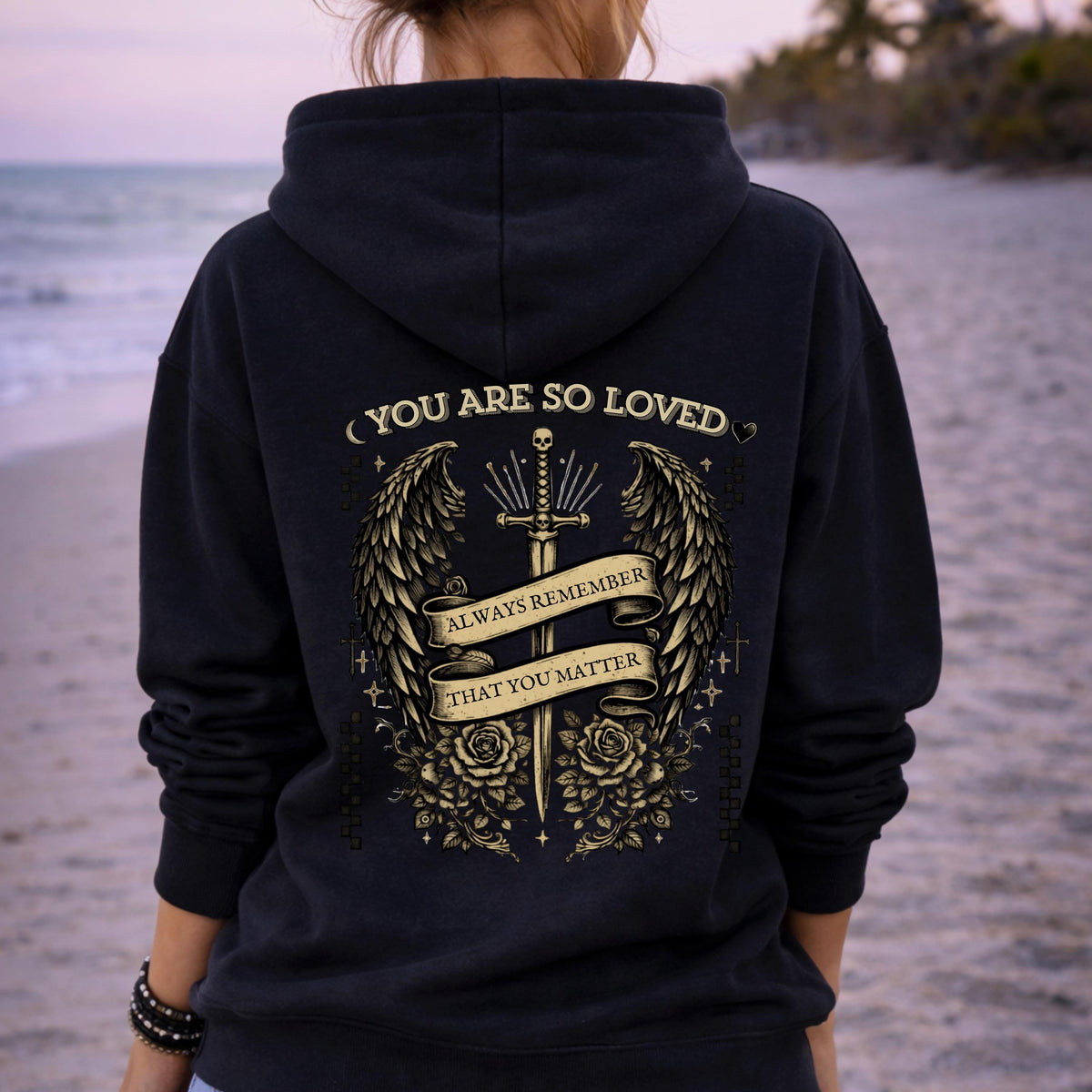 Gothic “You Are So Loved” hoodie with winged dagger and roses back design