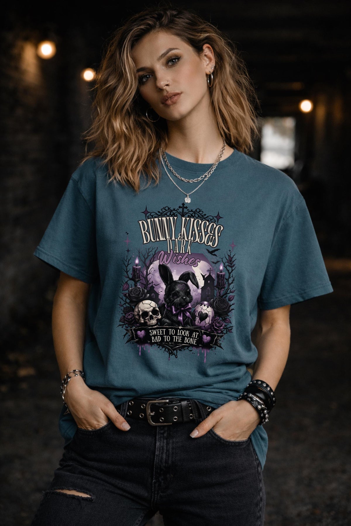 Woman wearing dark gothic bunny graphic t-shirt with text Bunny Kisses Dark Wishes Sweet To Look At Bad To The Bone styled with black jeans