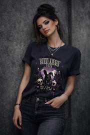 Woman wearing dark gothic bunny graphic t-shirt with text Bunny Kisses Dark Wishes Sweet To Look At Bad To The Bone styled with black jeans