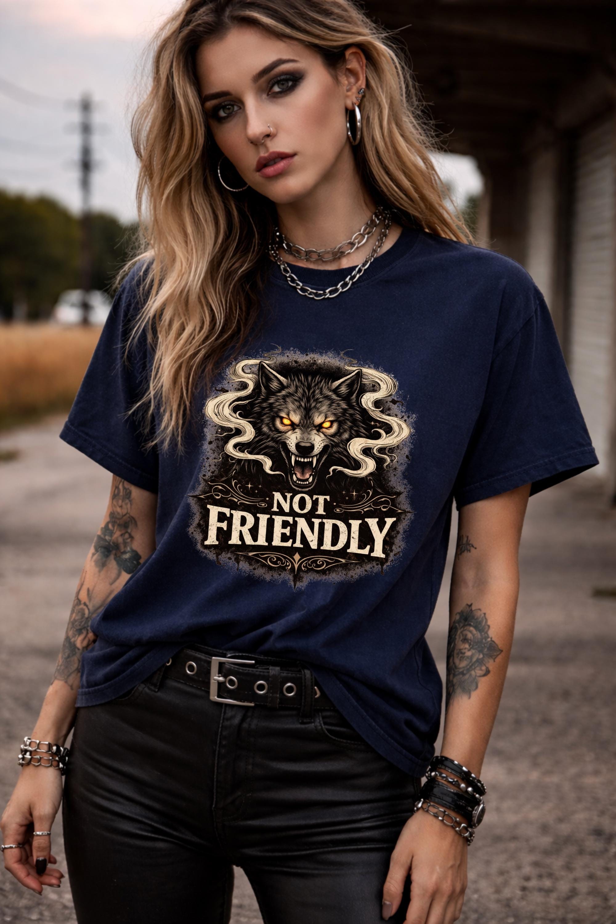Graphic t-shirt featuring snarling wolf with glowing eyes and “Not Friendly” text, worn by model on beach with casual summer outfit