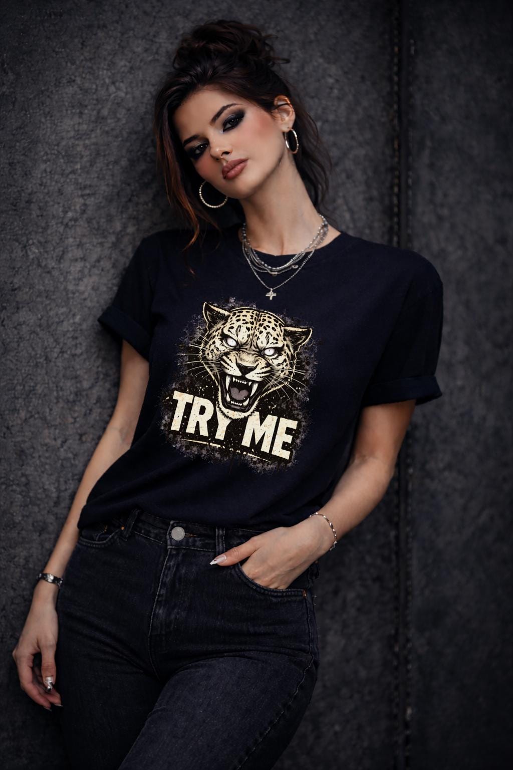 Graphic t-shirt featuring fierce leopard with bold “Try Me” text, styled on model with edgy casual outfit in outdoor setting