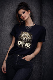 Graphic t-shirt featuring fierce leopard with bold “Try Me” text, styled on model with edgy casual outfit in outdoor setting