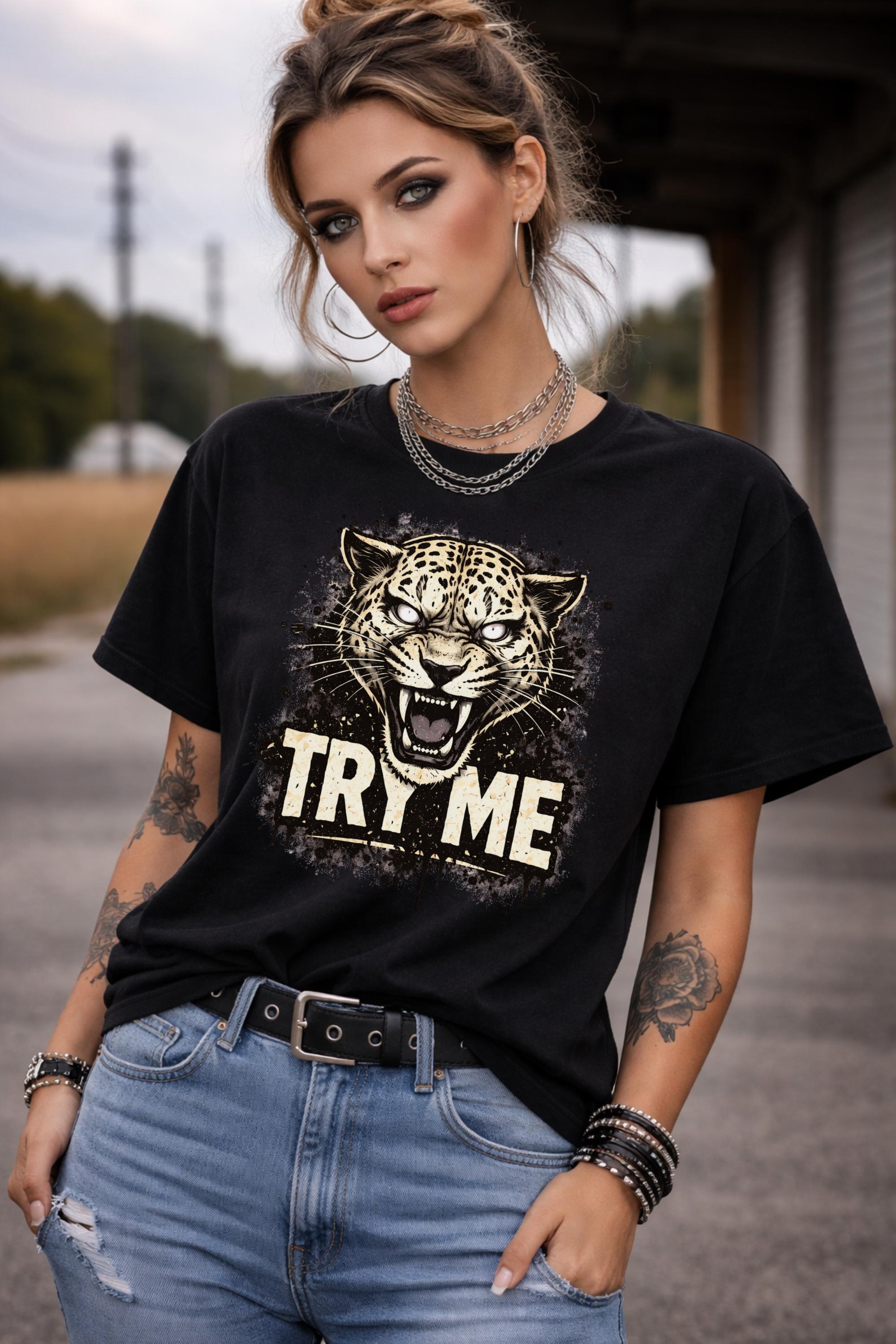 Graphic t-shirt featuring fierce leopard with bold “Try Me” text, styled on model with edgy casual outfit in outdoor setting