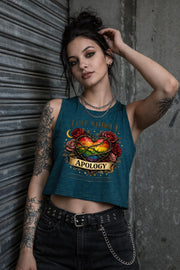 Bella Canvas women’s cropped tank top featuring rainbow heart with roses and “Love Without Apology” text, styled on model with edgy streetwear aesthetic