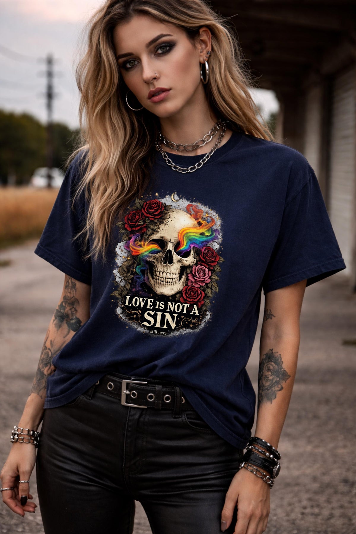 Graphic t-shirt featuring skull with rainbow accents and roses with “Love Is Not a Sin” text, styled on model with edgy alternative streetwear aesthetic