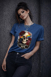 Graphic t-shirt featuring skull with rainbow accents and roses with “Love Is Not a Sin” text, styled on model with edgy alternative streetwear aesthetic