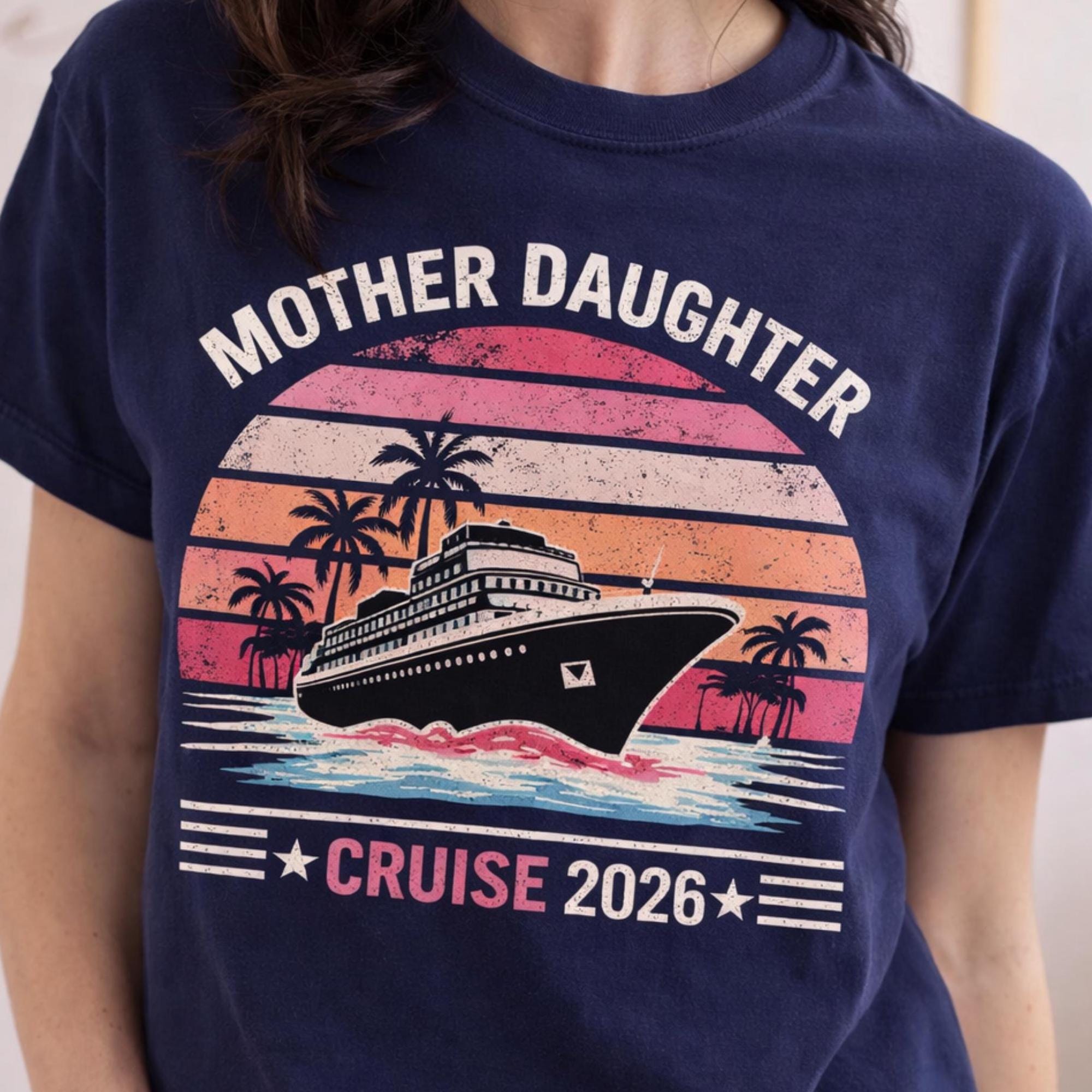 Woman wearing a True Navy Comfort Colors t-shirt featuring a retro Mother Daughter Cruise 2026 design with a vintage sunset, palm trees, and cruise ship graphic