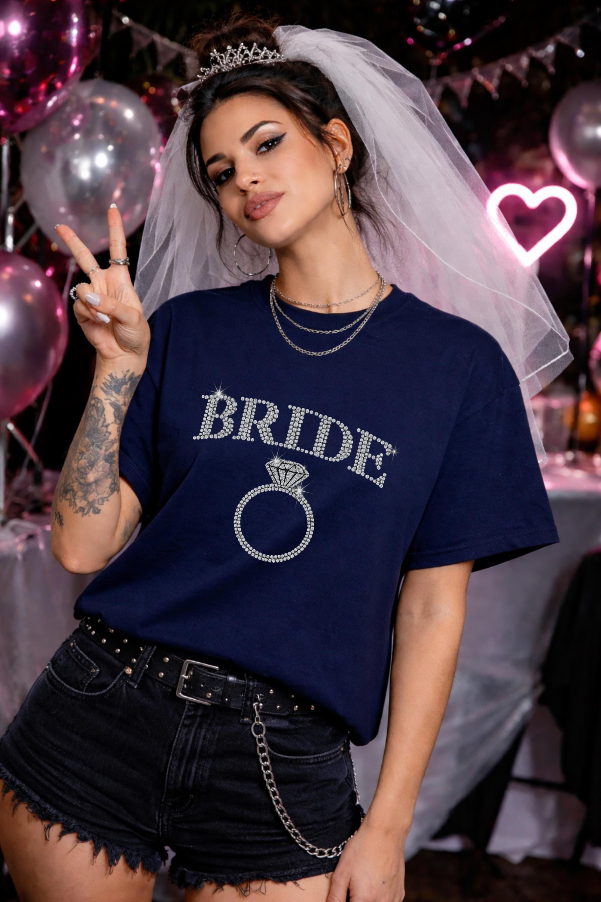 Bride rhinestone shirt with diamond ring graphic, woman wearing navy blue t-shirt with sparkling bride text, bachelorette party outfit