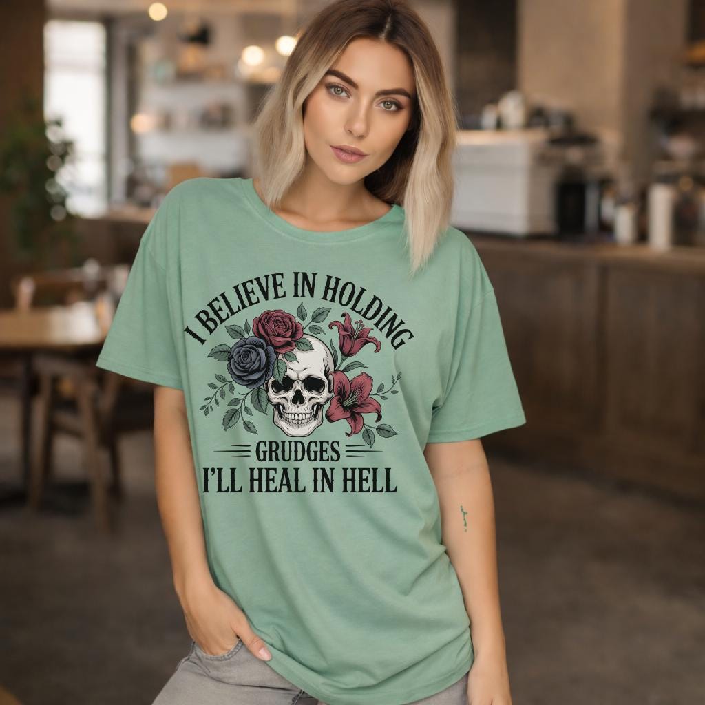 Edgy gothic skull graphic t-shirt with floral design and bold text, dark aesthetic unisex tee, emo grunge clothing style