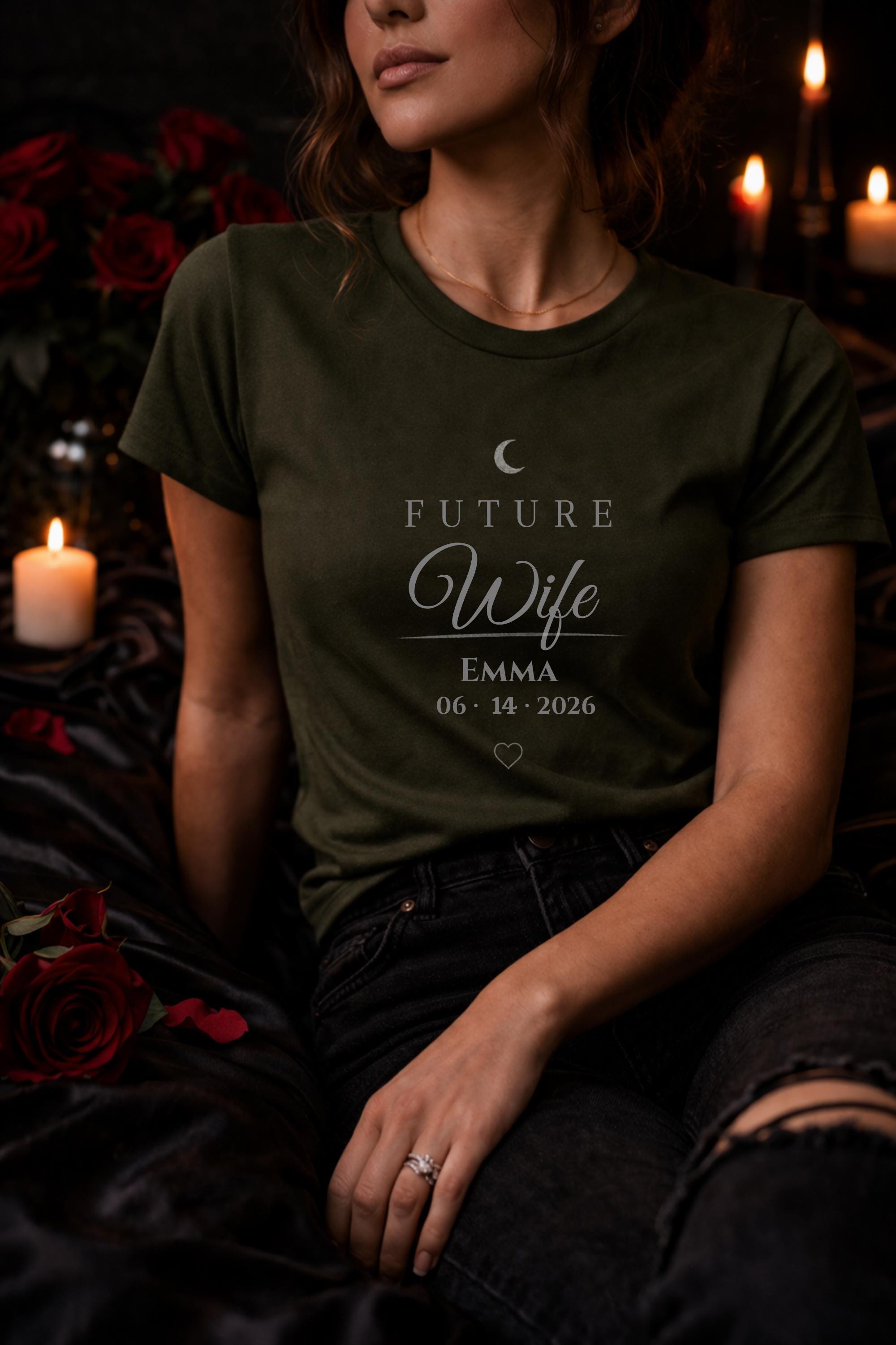 matching future husband and future wife shirts with personalized names and date worn by couple in moody dark romance style