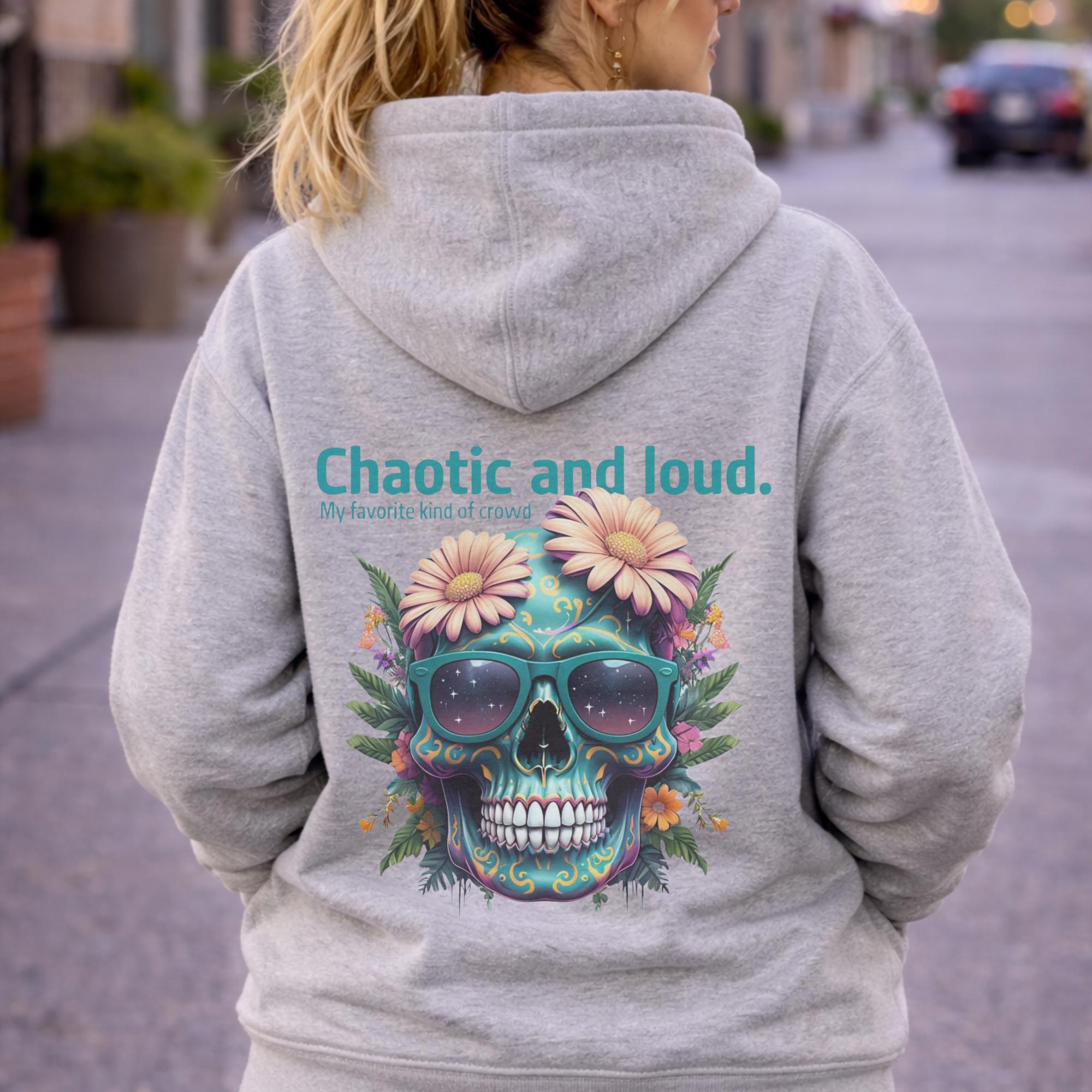 Back view of woman wearing a carbon grey Premium Pullover Hoodie Cotton Heritage M2580 featuring a colorful floral skull with sunglasses design and the text “Chaotic and loud, my favorite kind of crowd” printed on the back