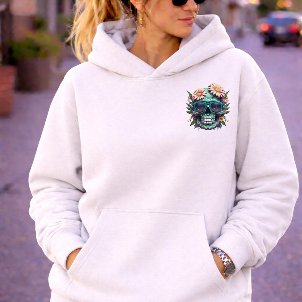 Front view of woman wearing a Premium Pullover Hoodie Cotton Heritage M2580 with a small colorful floral skull with sunglasses design on the chest