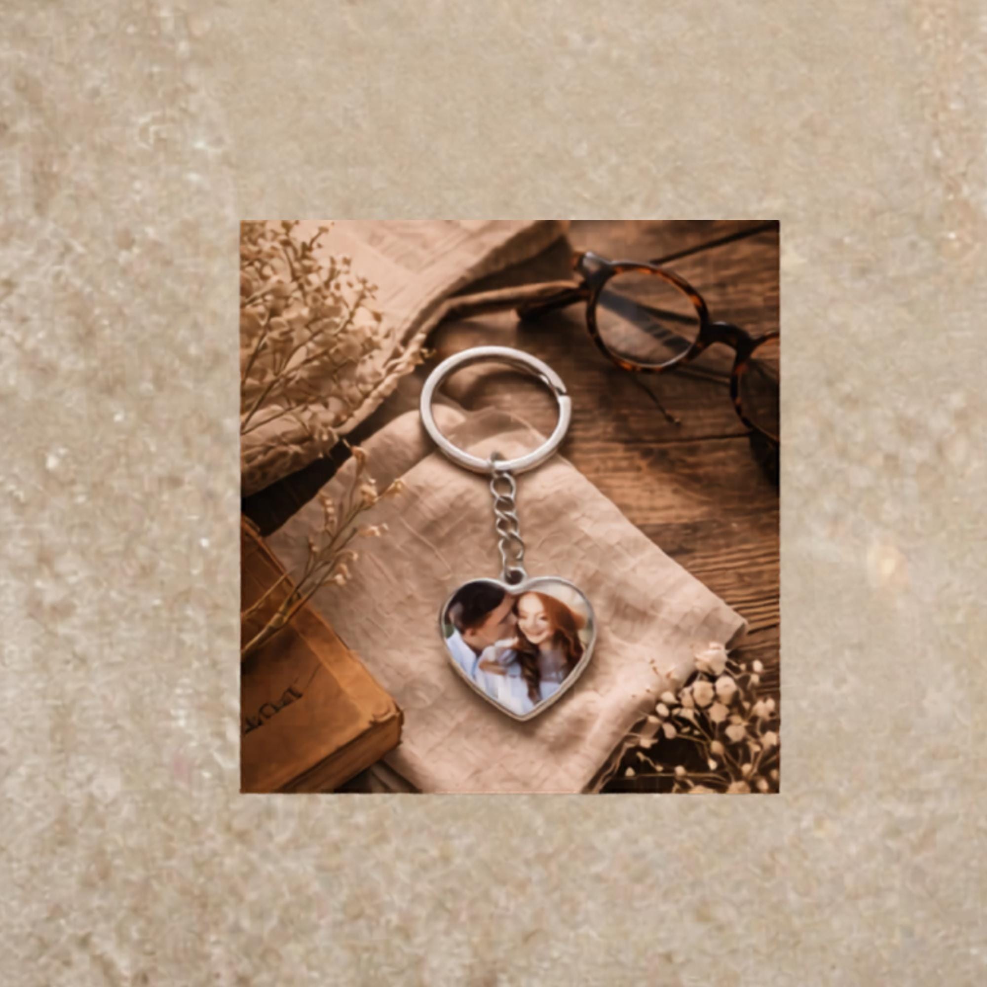 Silver heart keychain with romantic couple photo on cozy styled background