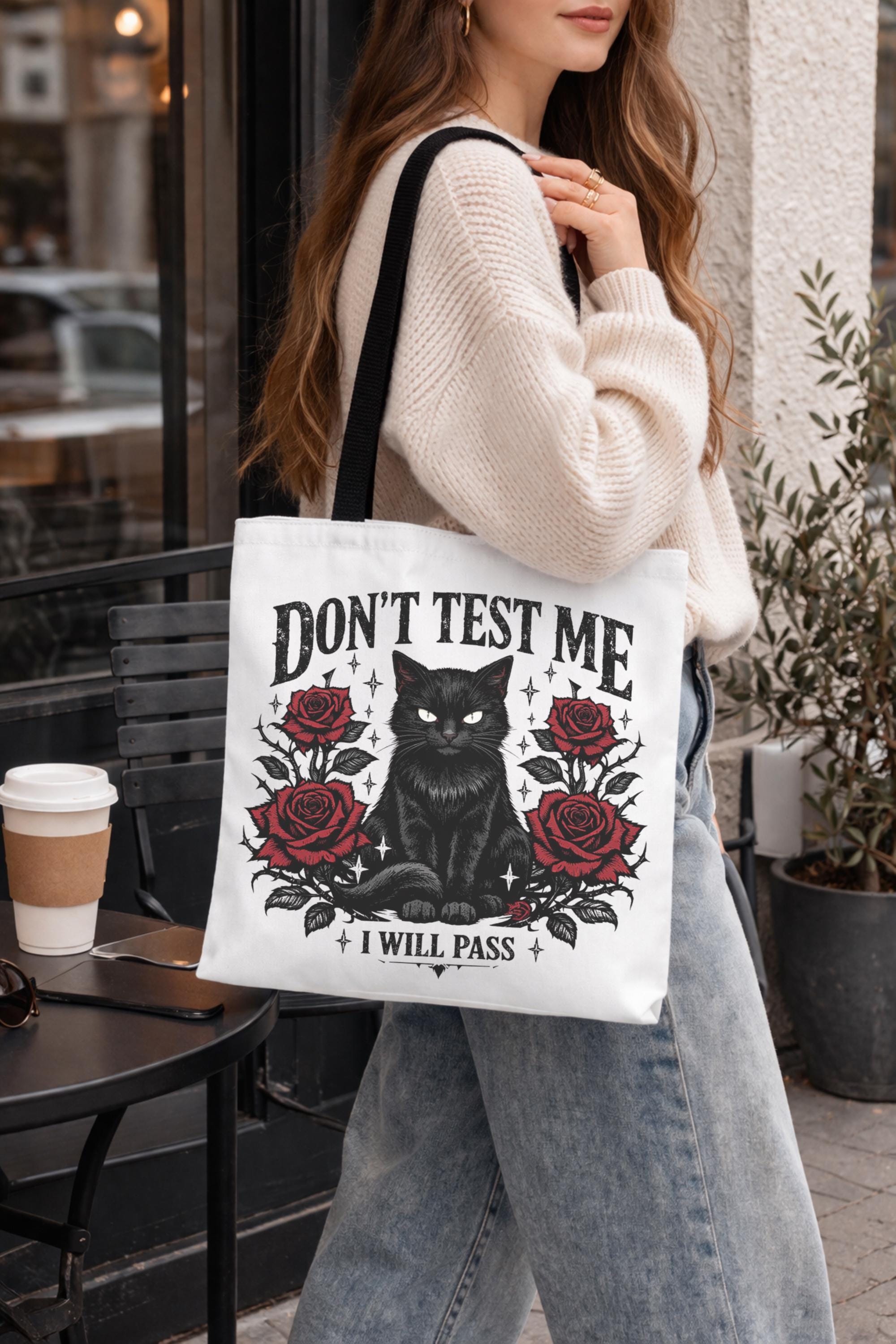 gothic tote bag with black cat and floral design on canvas bag with text "Don't Test Me, I will pass" on the bag.