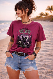 Woman wearing dark gothic bunny graphic t-shirt with text Bunny Kisses Dark Wishes Sweet To Look At Bad To The Bone styled with blue jean shorts