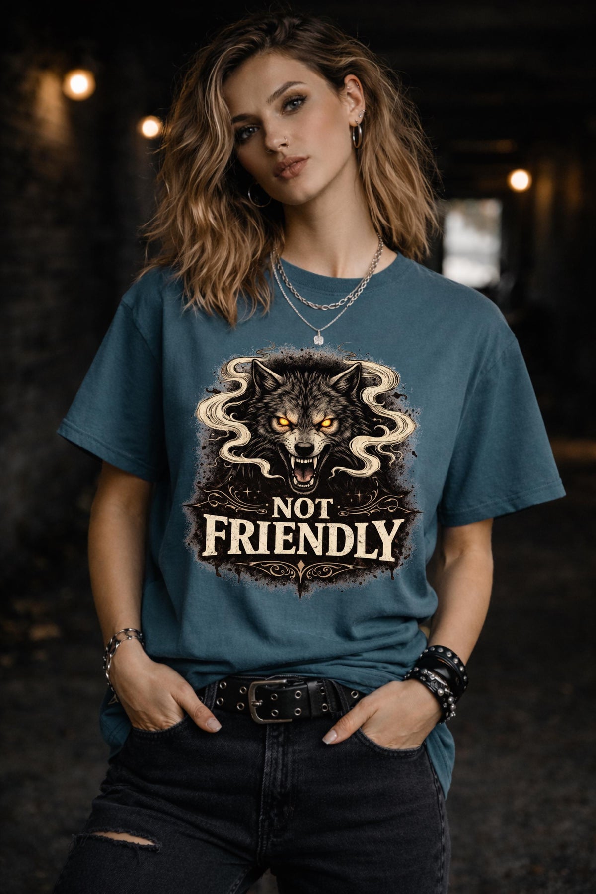 Graphic t-shirt featuring snarling wolf with glowing eyes and “Not Friendly” text, worn by model on beach with casual summer outfit