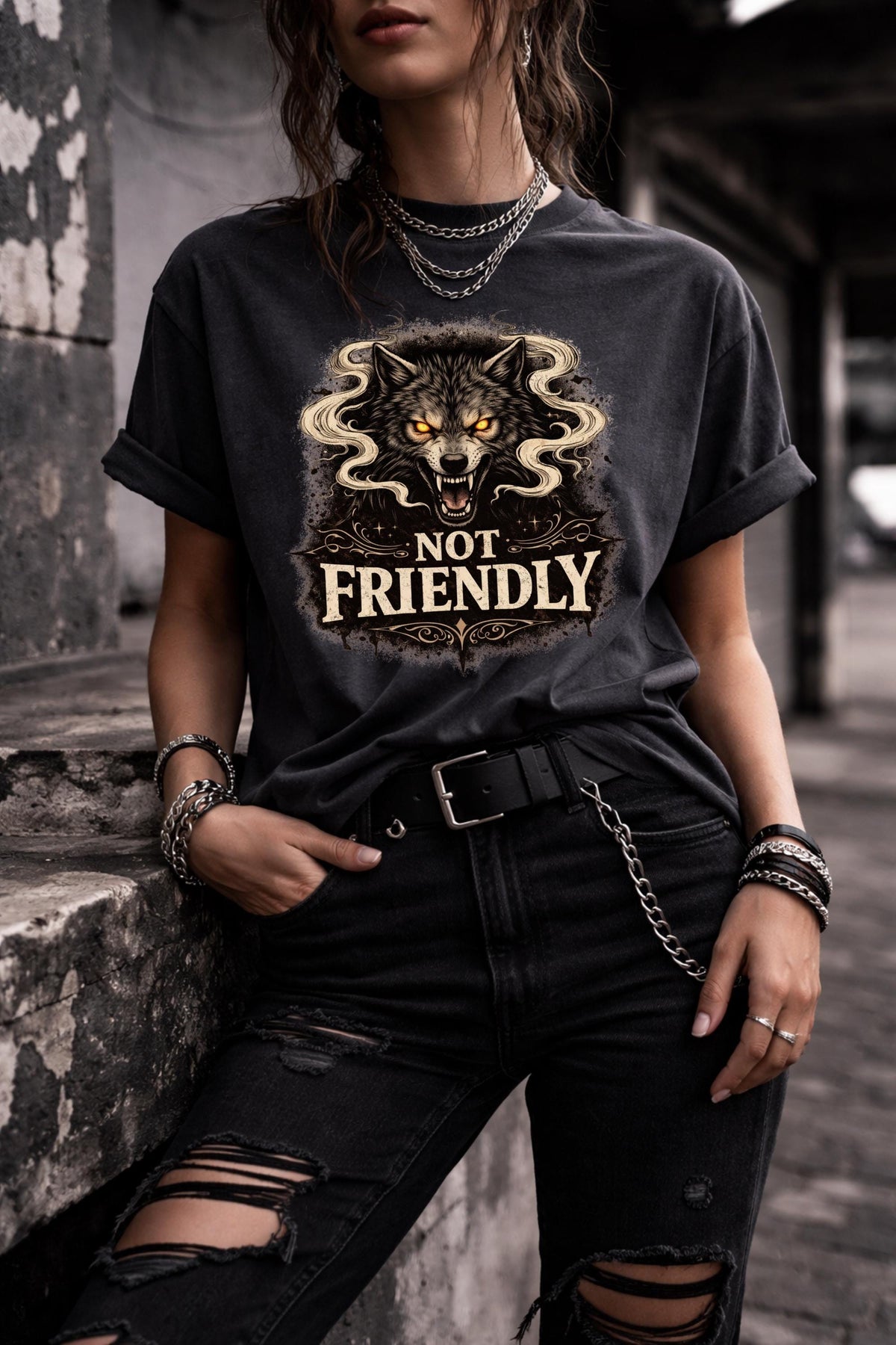 Graphic t-shirt featuring snarling wolf with glowing eyes and “Not Friendly” text, worn by model on beach with casual summer outfit