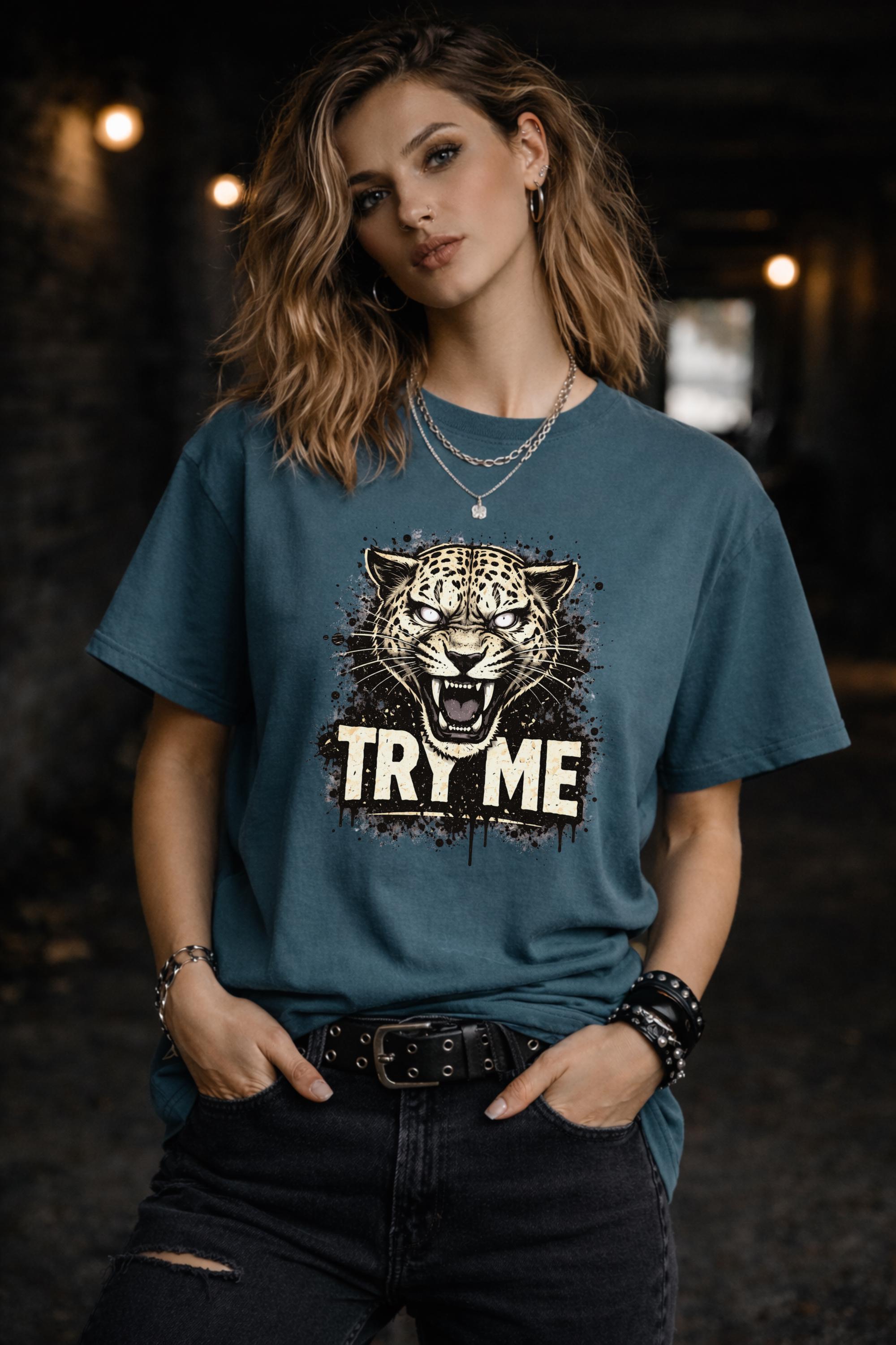 Graphic t-shirt featuring fierce leopard with bold “Try Me” text, styled on model with edgy casual outfit in outdoor setting