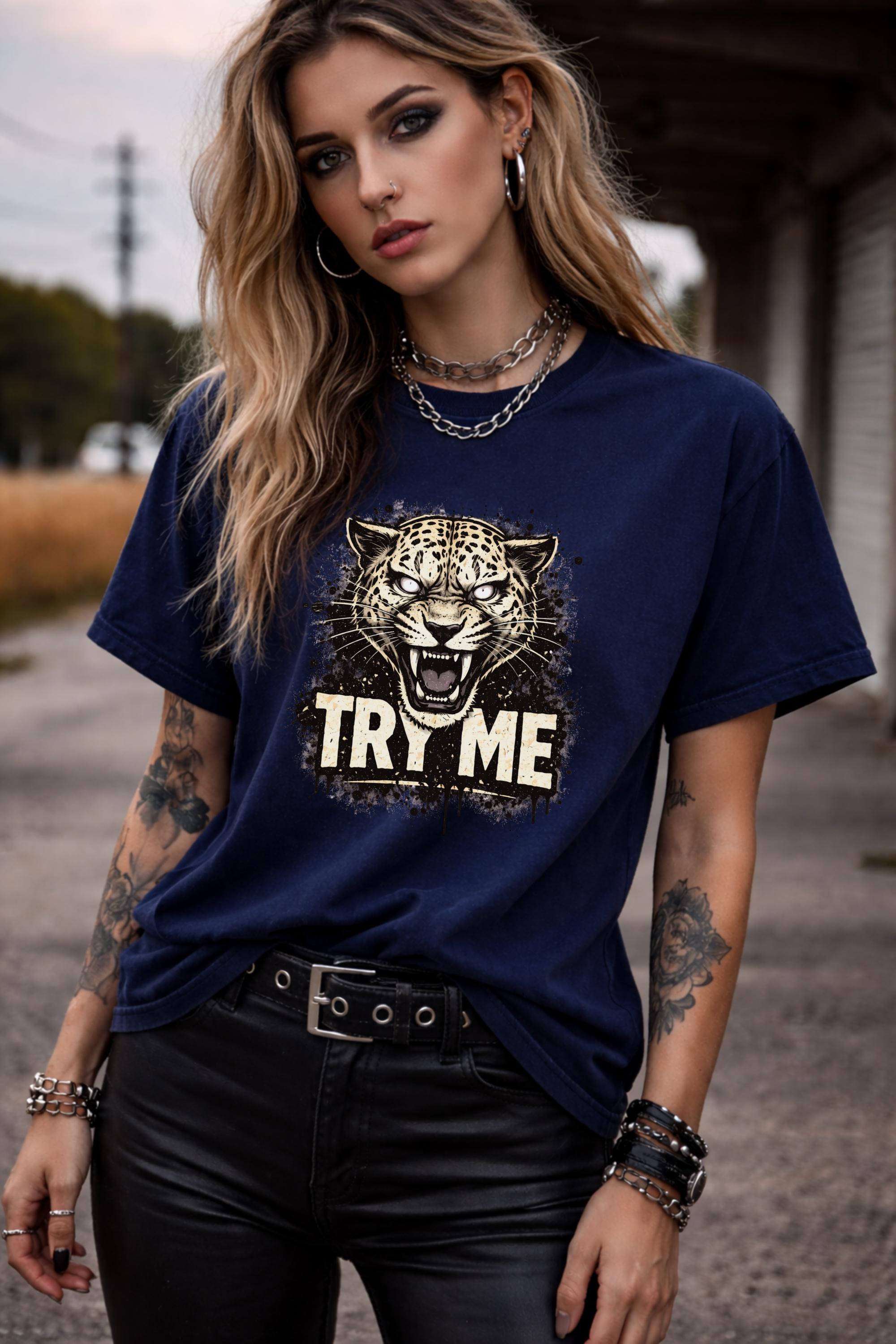 Graphic t-shirt featuring fierce leopard with bold “Try Me” text, styled on model with edgy casual outfit in outdoor setting