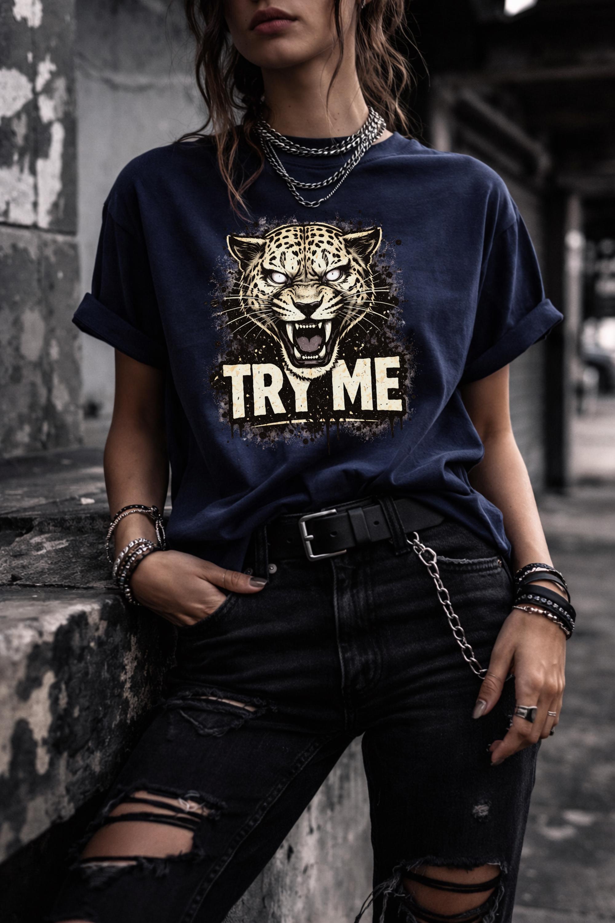 Graphic t-shirt featuring fierce leopard with bold “Try Me” text, styled on model with edgy casual outfit in outdoor setting