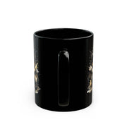 Black ceramic 11oz mug featuring the handle on the mug with a cute watercolor dragon with glowing eyes, styled on rustic wood table with candle, coffee beans, and cozy kitchen background