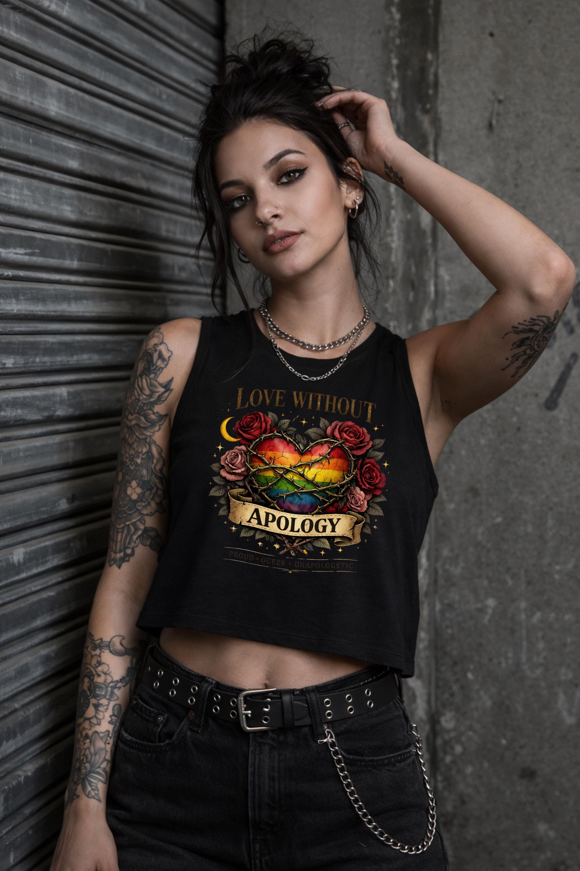 Bella Canvas women’s cropped tank top featuring rainbow heart with roses and “Love Without Apology” text, styled on model with edgy streetwear aesthetic