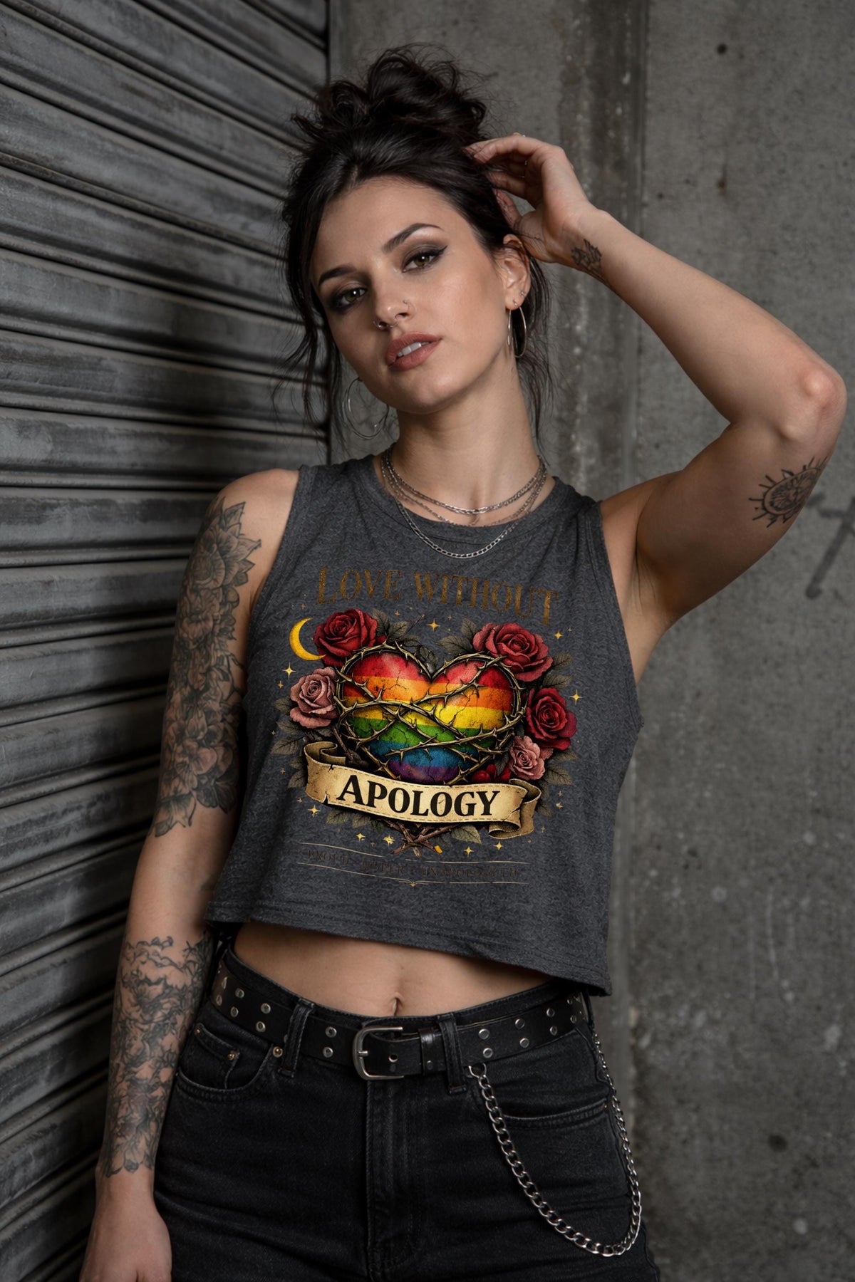 Bella Canvas women’s cropped tank top featuring rainbow heart with roses and “Love Without Apology” text, styled on model with edgy streetwear aesthetic