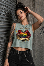 Bella Canvas women’s cropped tank top featuring rainbow heart with roses and “Love Without Apology” text, styled on model with edgy streetwear aesthetic