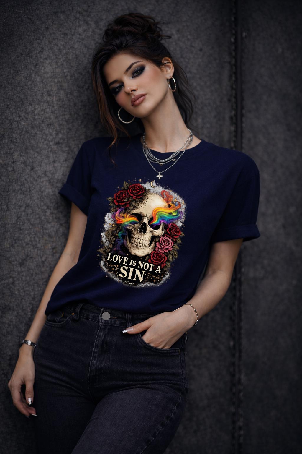 Graphic t-shirt featuring skull with rainbow accents and roses with “Love Is Not a Sin” text, styled on model with edgy alternative streetwear aesthetic