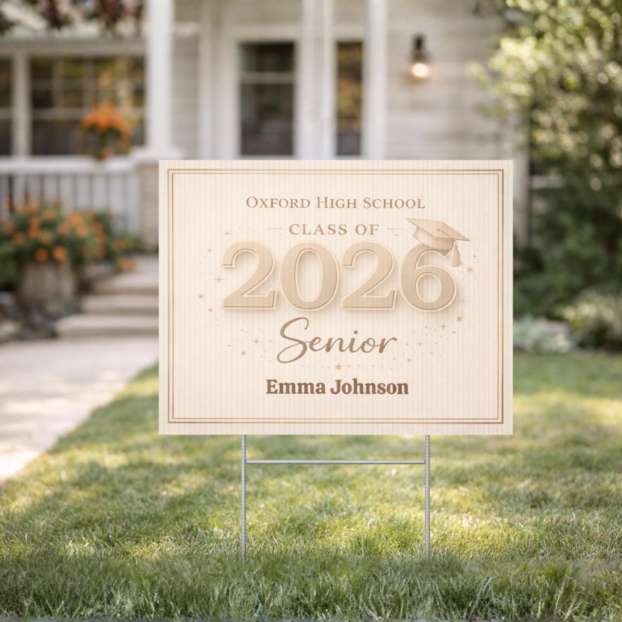Neutral beige Class of 2026 graduation yard sign with custom name displayed on lawn in front of house, elegant senior decor sign