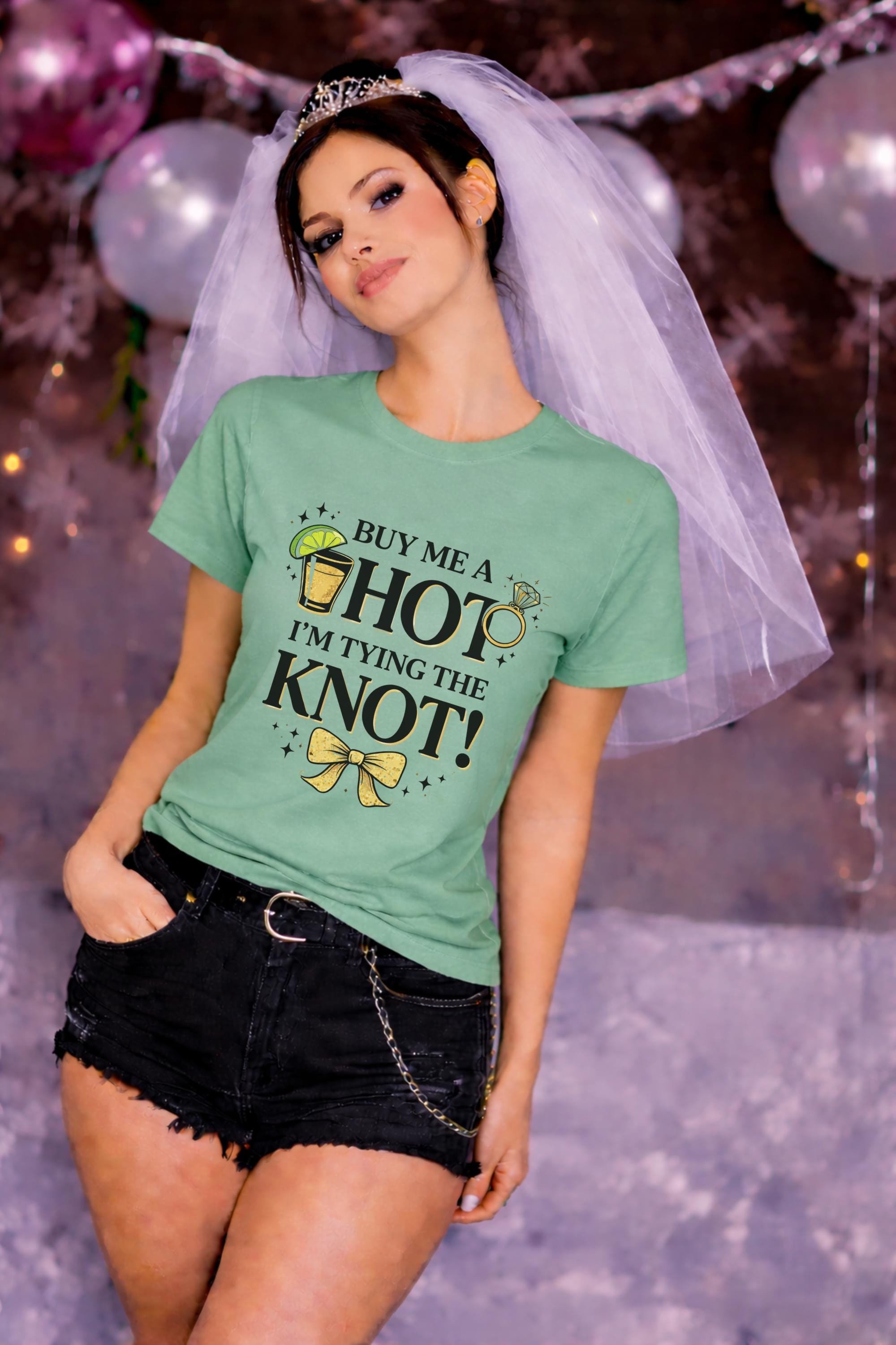 Buy me a shot I’m tying the knot bachelorette shirt, woman wearing sage green tee with cocktail graphic, fun bride outfit