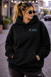 Mental health awareness hoodie with uplifting quote worn by woman in everyday lifestyle setting
