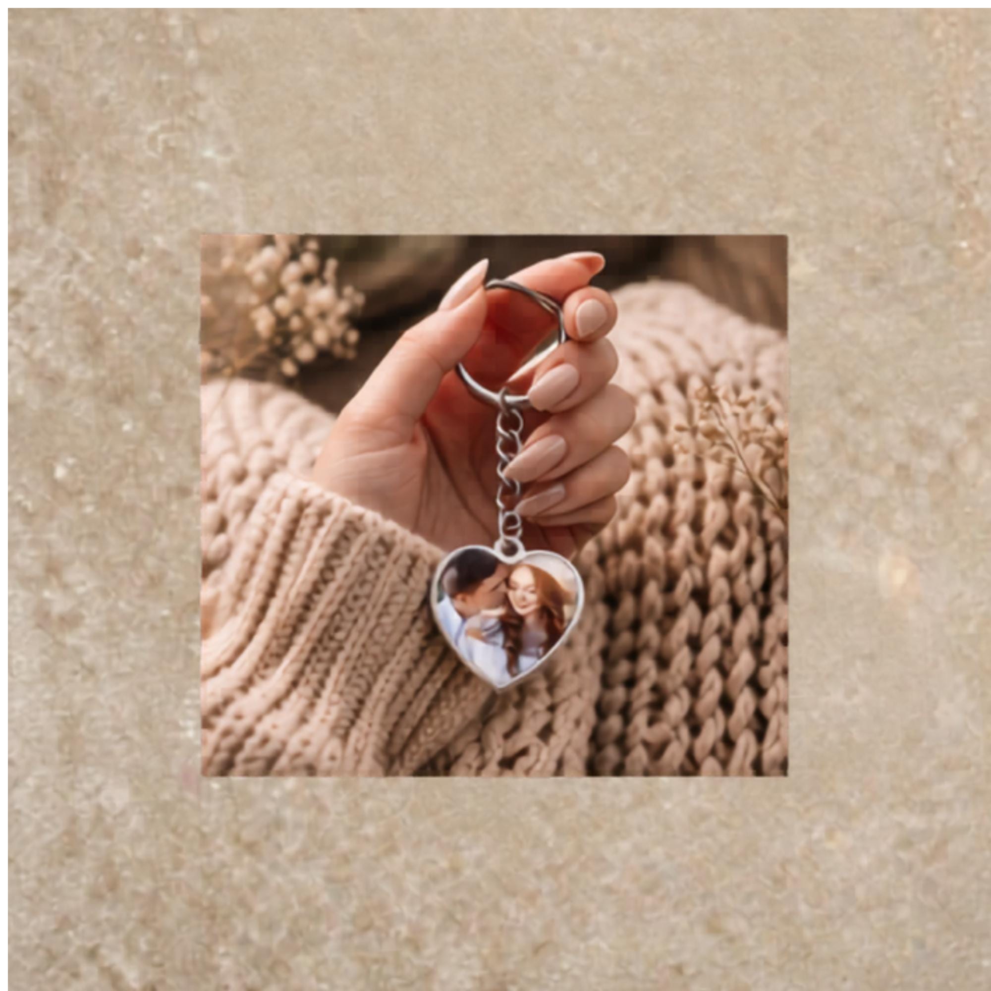 Silver heart keychain with romantic couple photo on cozy styled background