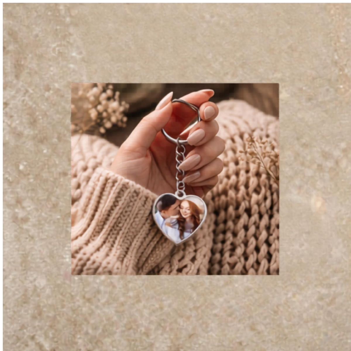 Silver heart keychain with romantic couple photo on cozy styled background