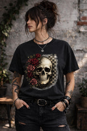 Comfort Colors 1717 t-shirt in black featuring a gothic skull with red roses and checkerboard background, worn by model outdoors
