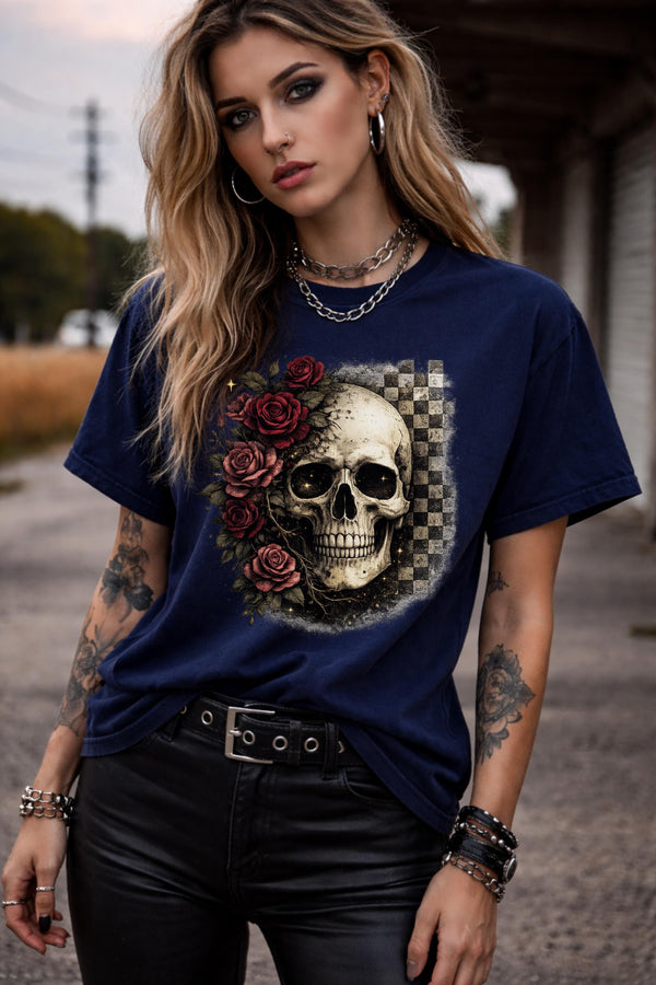 Comfort Colors 1717 t-shirt in midnight featuring a gothic skull with red roses and checkerboard background, worn by model outdoors