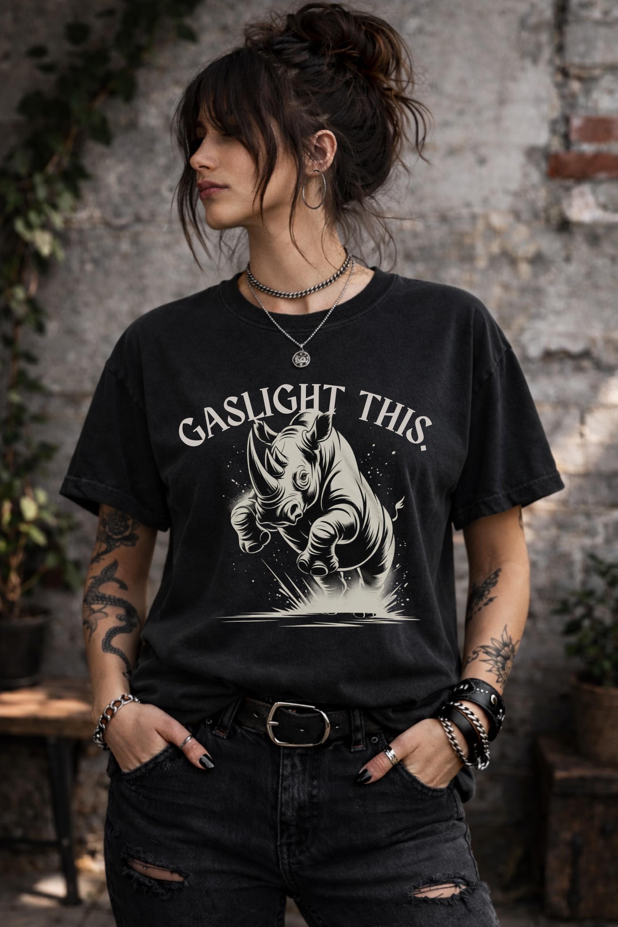 Edgy woman model in ripped jeans wearing funny gaslight this slogan shirt lifestyle mockup