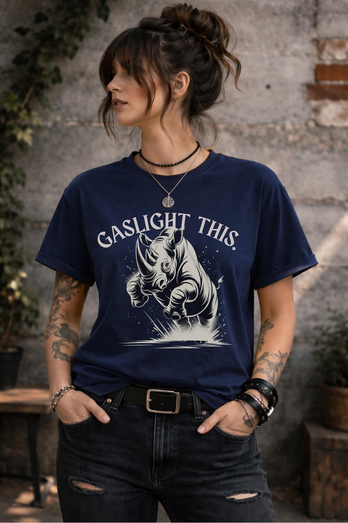 Edgy woman model in ripped jeans wearing funny gaslight this slogan shirt lifestyle mockup