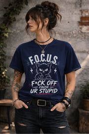 Woman wearing dark gray sarcastic cat graphic t-shirt with bold funny text outdoors