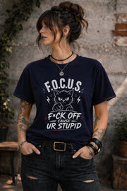 Woman wearing dark gray sarcastic cat graphic t-shirt with bold funny text outdoors