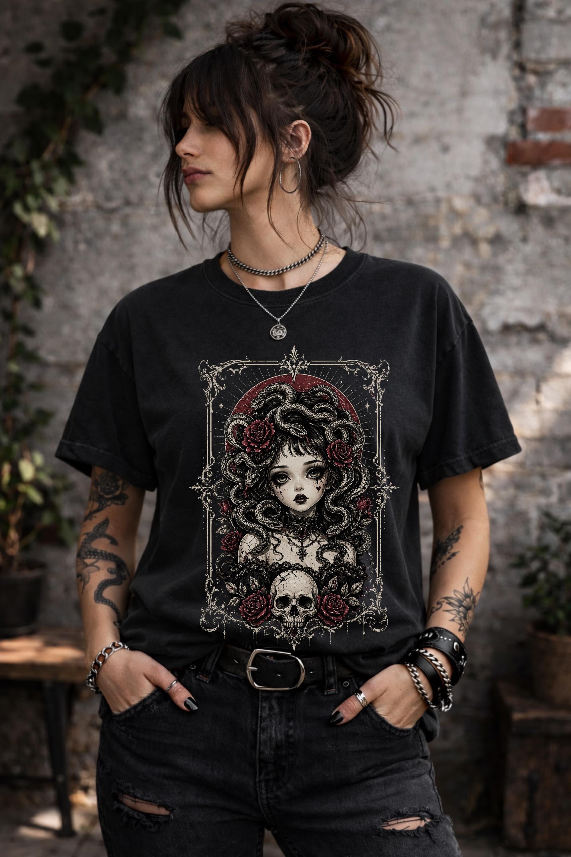Trendy alt style graphic tee with snake woman design worn by woman outdoors