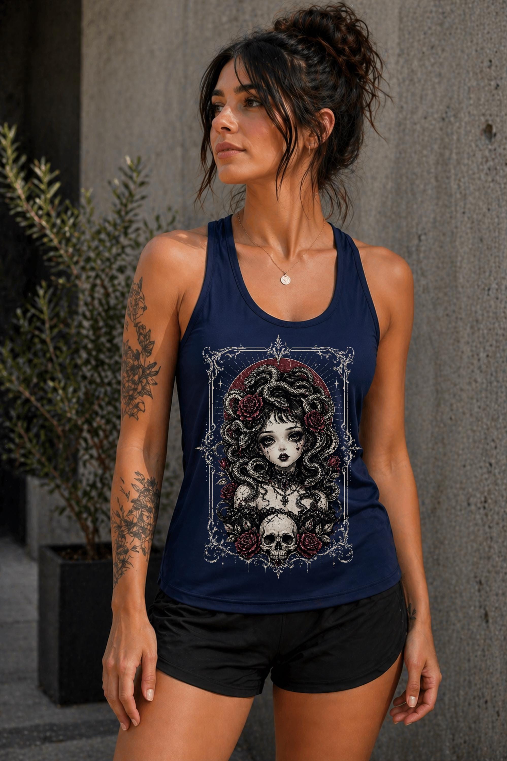 Trendy womens racerback tank with dark navy art Medusa graphic and rose accents