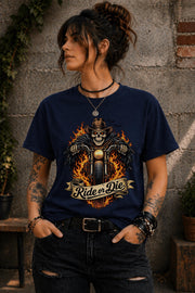 Woman wearing navy biker graphic shirt with skull motorcycle ride or die design
