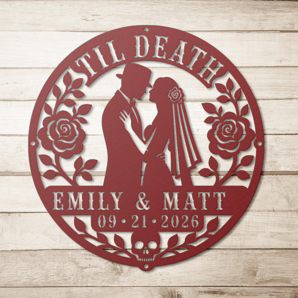 Gothic metal wall decor with til death couple design and custom names displayed above a rustic console with candles and skull accents