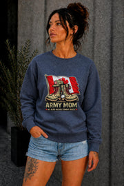 Woman wearing black crewneck sweatshirt with Army Mom design featuring combat boots and Canadian flag, patriotic military mom sweater, casual fall outfit